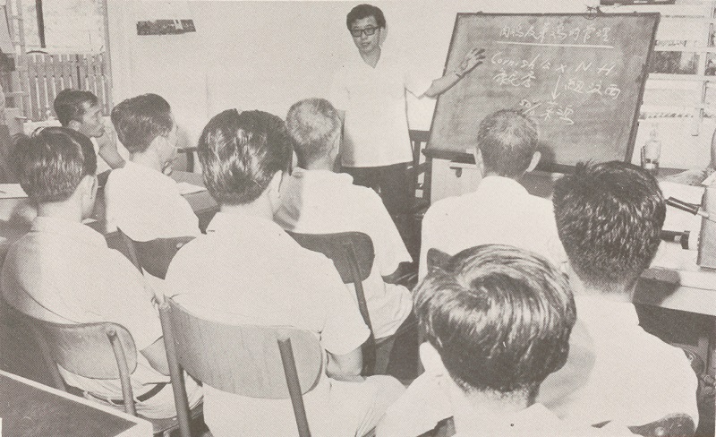 An extension officer giving a talk to farmers