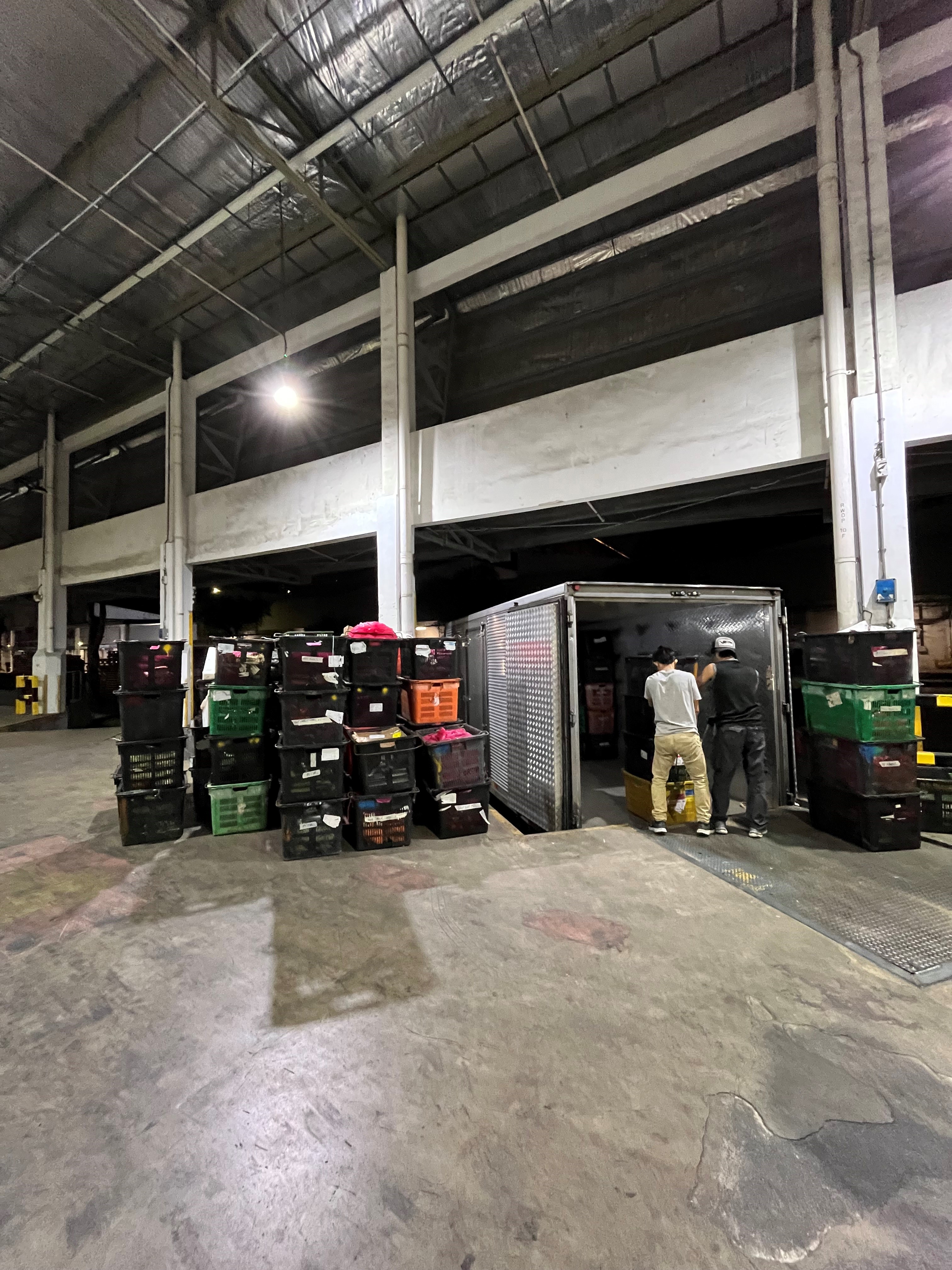 Truck drivers unloading imports for inspection. (Photo: SFA)